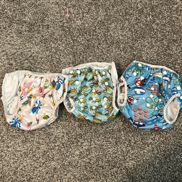 Adjustable reusable swim diapers set of 3 with snap closures to adjust size - Picture 3 of 3